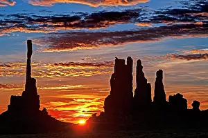 Navajo: Sunrise with Totem Pole backlit, Monument Valley