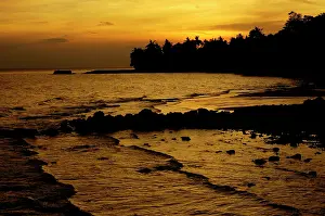 Tioman: Sunset over a beach and rainforest on slopes of