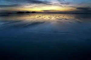 Tofino: Sunset at beach with water withdrawing