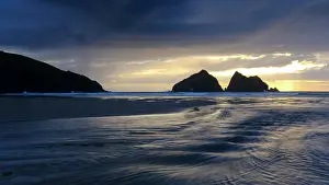 Newquay: Sunset behind dark clouds, Holywell Beach, Holywell