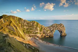 Features: Sunset over Durdle Door along the Jurassic Coast