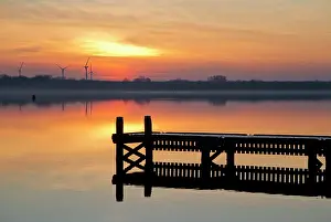 Zeeland: Sunset over a lake with a landing stage