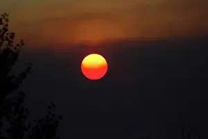 Emission: Sunset though Smokey Haze from Burnoffs