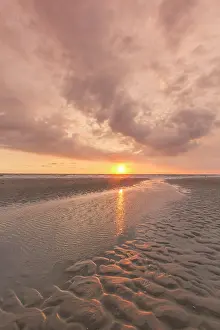 Wadden: Sunset over a tidal creek in the mudflats - Wadden