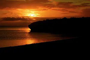 Timothy: Sunset on the water along the coastline