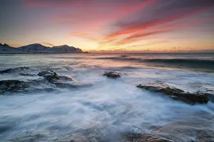 Norwegian: Sunset in winter at Skagsanden, rock formations on the beach
