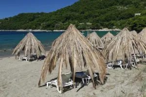 Croatia: Sunshades at the sand beach at Saplunara, island