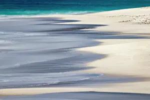 Galapagos: Surf pattern washing up on white sandy beach, Espanola