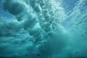 Tuamotu: Surf on the reef at the entrance to Tiputa pass