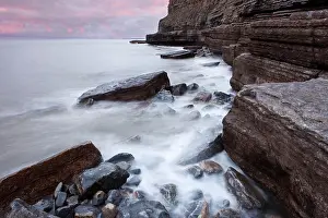 Breakers: Surf on the rocky coast with cliffs, Dunraven Bay