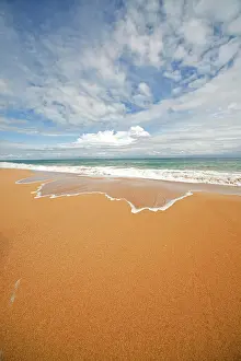 Bodies: Surf on the sandy beach of Bluff Beach on the island