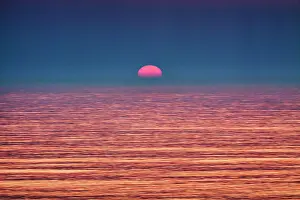 Smooth: Surreal sunset at the sea, smooth water surface
