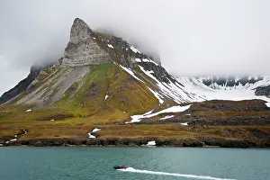 Heading: Svalbard - Zodiac heading to land - with dramatic