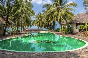 Decorated: Swimming pool in tropical resort with palm trees