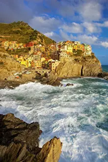 Wavy: Swirling ocean at the foot of medieval town