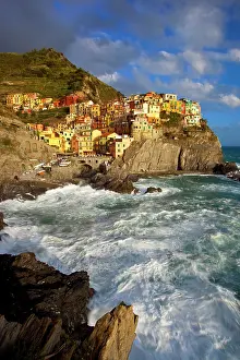 Wavy: Swirling ocean at the foot of medieval town