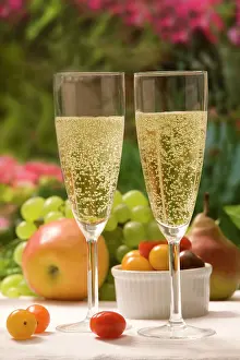 Sparkling: Table - with two glasses of sparkling wine and fruit