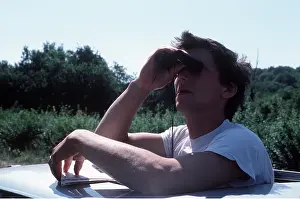 Hobbies: TEENAGER BIRD WATCHING - from top of car