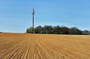Ploughed: Telecommunication tower in the countryside at Luzarches