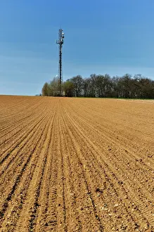 Ploughed: Telecommunication tower in the countryside at Luzarches