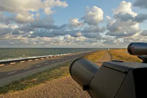 Dike: Telescopes watching over the North sea in autumn