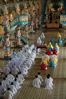 Prayer: Temple Interior with Caodaist disciples sitting