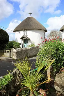 Cottages: Thatched Roof Round White Washed Cottages