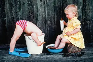 Jack: Three-year old girl bathes her feet, boy puts head i