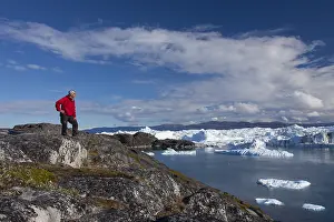 Expedition: Tourist looking at the Icefjord - Disco Bay - Greenland