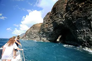 230518: Tourists on a boat viewing a cave entrance on the