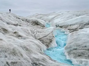 Tourists: Tourists hiking on the ice. The brown sediment on