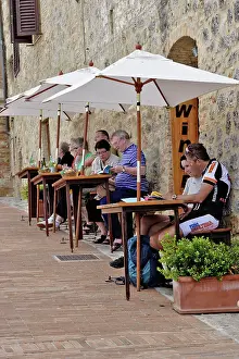 Housing: Tourists at outdoor cafe, Monteriggioni
