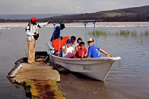 Birdwatchers: Tourists taking boat trip to view flamingos