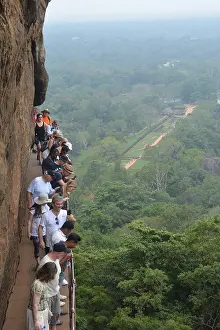 Visiting: Tourists visiting historic Sigirya Rock, World Heritage