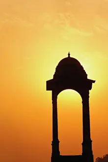 Delhi: Tower near the India Gate silhouetted at