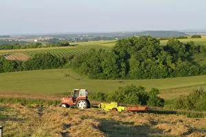Frazier: Tractor baling hay west of Angouleme in