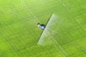 Rice: Tractor spraying fungicide onto the rice fields