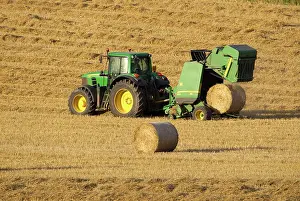 Release: Tractor stopping to allow hay bale making machine