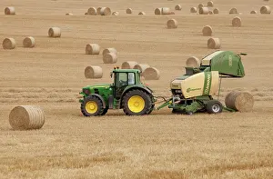 Release: Tractor stopping to allow hay bale making machine