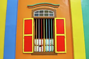300517: Traditional rainbow coloured house with colourful window