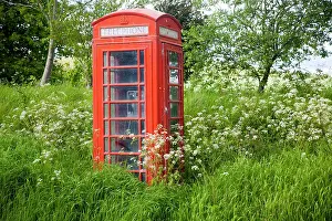 Sale: Traditional red telephone box in rural area becoming