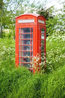 Sale: Traditional red telephone box in rural area becoming