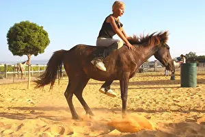 Obedience: Training exercise of a Horse by a young rider