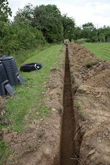 Cables: Trench dug out in field to carry electric cable ducting