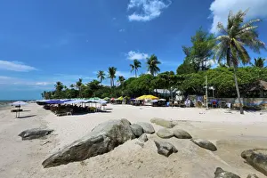 Vacations: Tropical palm tree beach at Hua Hin, Thailand
