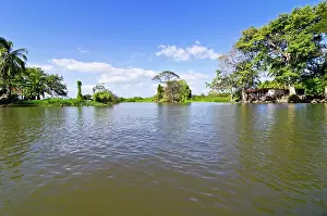 Mesoamerica: Tropical vegetation and a house on a small island