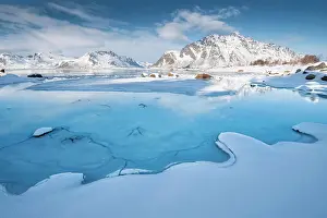 Floes: Turquoise lagoon with snow surface and ice floes