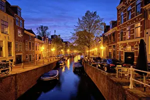 Loading: Typical Netherlands view, canal with boats and h