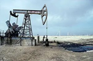 Pump: A typical oil-pump on an oil-well with a puddle