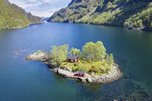 Typical: Typical red norwegian cottage on a little island